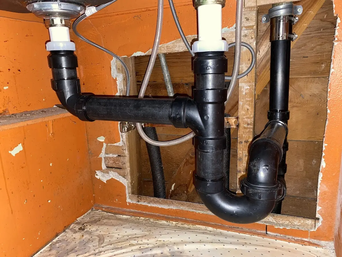 Professional Garbage Disposal Repair equipment and tools on the job in Moulton